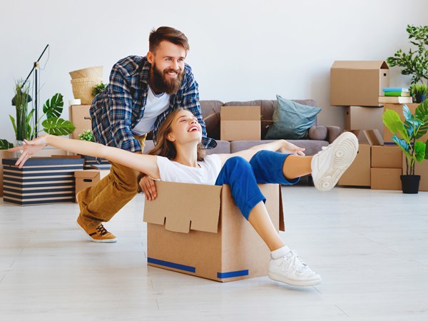 couple playing with moving boxes