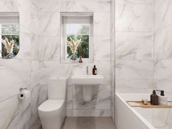 contemporary bathroom in the cromer two-bedroom home with marble-effect tiles, white fixtures, a bathtub, and a window bringing in natural light.