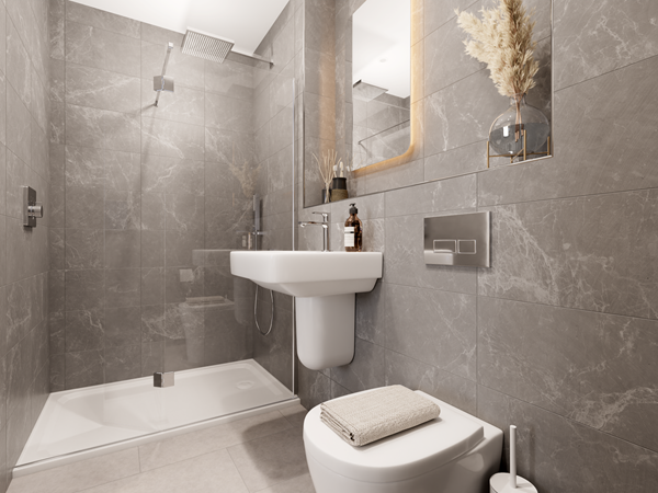 Sophisticated en-suite bathroom with dark gray marble-effect tiles, a glass-enclosed shower, and a wall-mounted sink beneath a backlit mirror. A white toilet is positioned on the right, and decorative elements like a vase with pampas grass add style.
