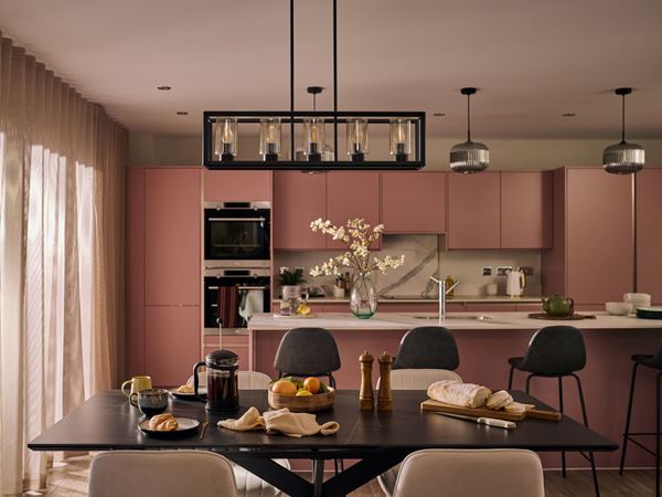 An open-plan kitchen and dining room in a modern Charles Church home.
