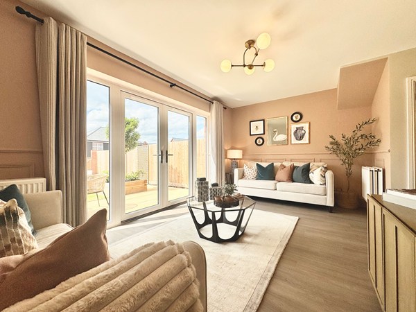Living room in the Brindle new build home with French doors to the garden.