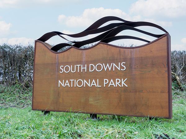 South Downs National Park entrance sign with sculptural metal design.