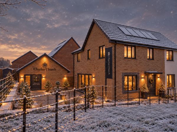 New home at Festival Park with festive lights, Christmas trees and snow.