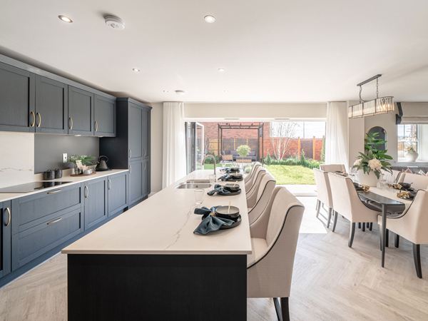 Open-plan kitchen and dining area overlooking the garden at Lockside