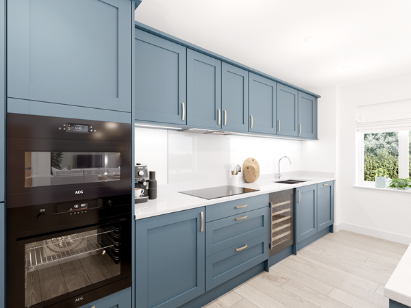Modern kitchen with blue shaker cabinets, white quartz worktops, built-in oven and wine cooler under bright lighting