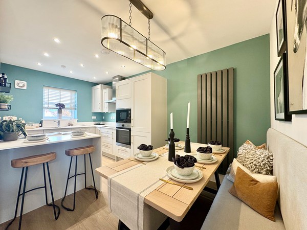 Kitchen and dining area in the Brindle new build home with island and fitted units.