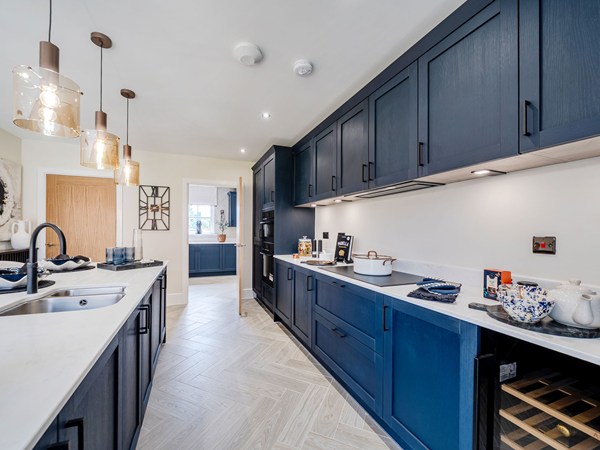 Open-plan dining area overlooking a contemporary fitted kitchen
