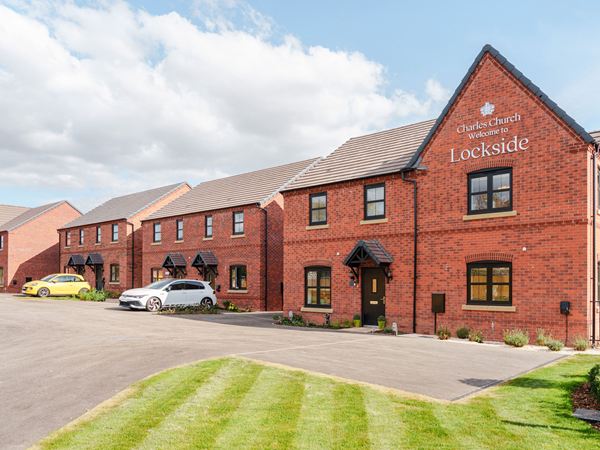 Street view of brick new build homes at Lockside development