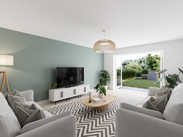 Bright living room with a green feature wall, a large flat-screen TV on a white media unit, and two light gray sofas arranged around a wooden coffee table. A chevron-patterned rug adds texture, and large glass doors open to a garden, bringing in natural light.