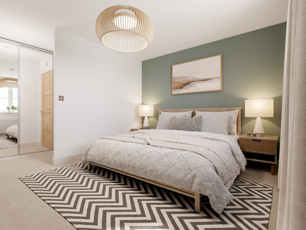 Modern bedroom with green feature wall, wooden bed frame, chevron rug, mirrored wardrobe and cosy neutral bedding