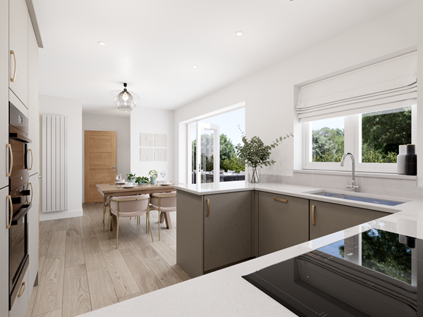 Stylish modern kitchen with integrated appliances, L-shaped worktop and dining area opening to garden patio.