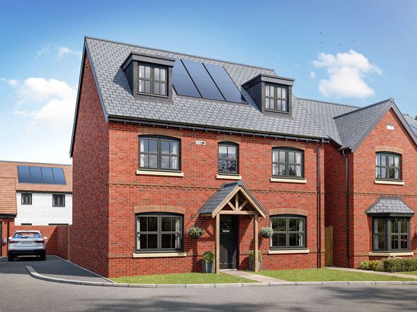 Front view of a detached new build home with solar panels, dormer windows, timber entrance porch and landscaped front garden.