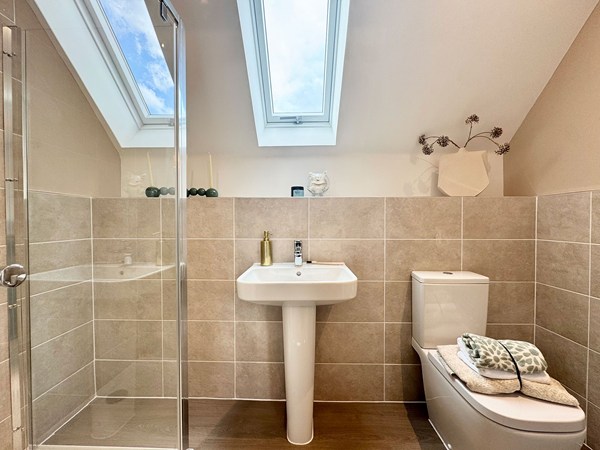 Shower room in the Brindle new build home with basin, WC and skylight.