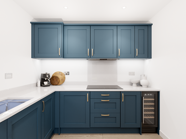 Modern kitchen with blue shaker cabinets, white quartz worktops, induction hob and built-in wine cooler