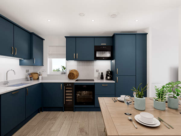 modern kitchen in the cromer two-bedroom home featuring navy blue cabinets, integrated appliances, white countertops, and a wooden dining table set for two.
