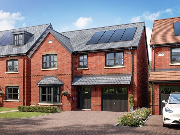 Front view of a detached family home with integral garage, driveway, solar panels and landscaped frontage.