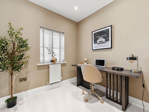 Modern home study with desk, chair and window