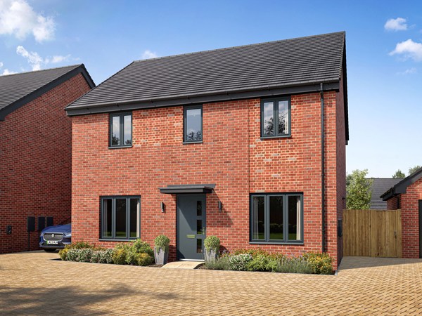 Front view of a red-brick new-build home with landscaped garden.