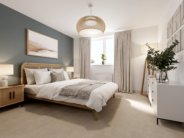 Bright bedroom with a large bed featuring a wooden frame and neutral bedding. A green feature wall adds color, complemented by wooden bedside tables and a white chest of drawers. A woven pendant light hangs from the ceiling, and natural light streams through a window with light curtains.