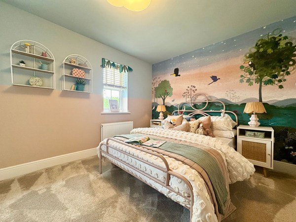 Double bedroom in the Brindle new build home with patterned feature wall.