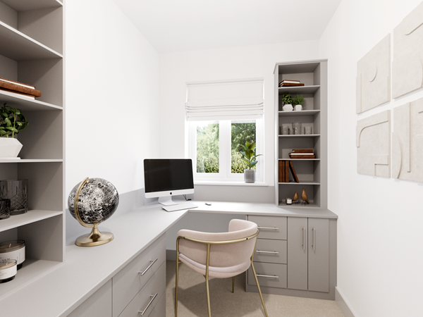 Modern home office with grey built-in desk and shelves, computer, pink chair and large window bringing natural light