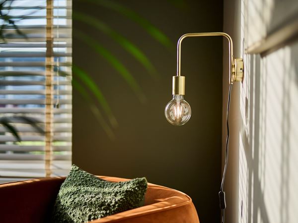 A beautifully decorated corner of a Charles Church home, with sunlight coming in through the window. 