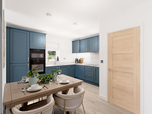 Contemporary kitchen-diner with blue shaker cabinets, integrated appliances and wooden dining table set for four.