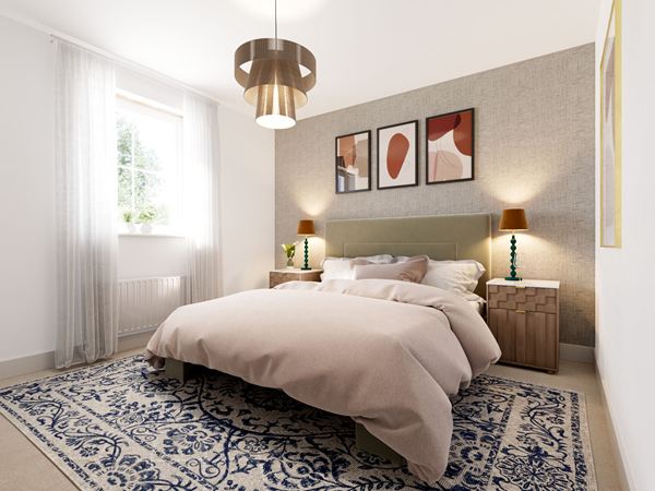 A beautifully decorated Charles Church bedroom with a double bed, blue rug, and feature wall with three prints.