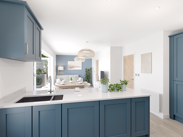 Modern kitchen with navy blue cabinets, white countertops, and a breakfast bar. The view extends to a dining area and living space with a blue feature wall. Large glass doors open to the garden, allowing natural light to flood the space.