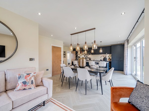 Open-plan dining area overlooking a contemporary fitted kitchen