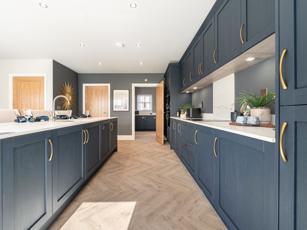 Open-plan kitchen dining area with island and garden views