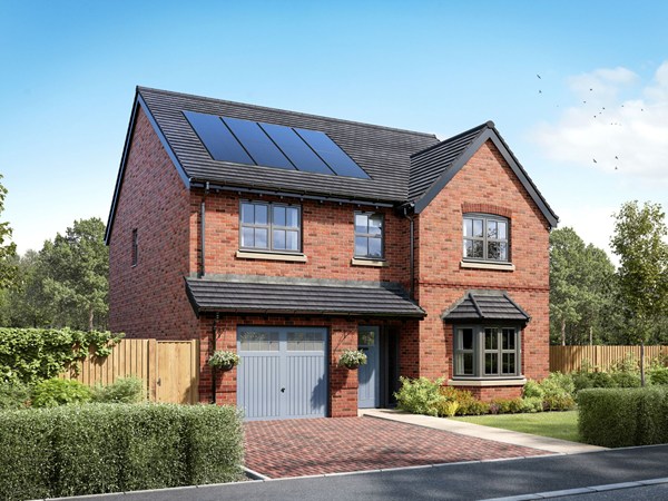 Two-story detached brick house with a gray tiled roof and solar panels. Features a garage on the left, white-framed windows, and a gray front door. A paved driveway and landscaped front garden with lavender plants complete the exterior.