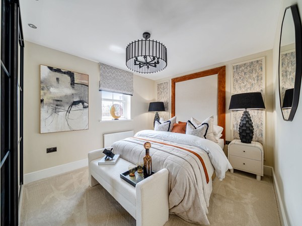Double bedroom with upholstered bed and contemporary neutral décor