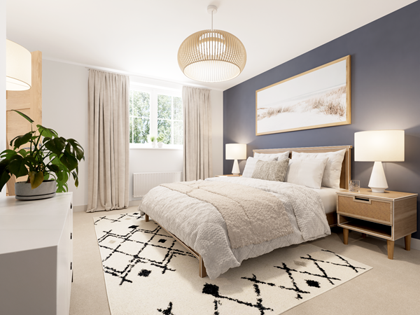 Modern bedroom with a large bed dressed in neutral bedding and cushions. A dark blue feature wall behind the bed adds depth, complemented by wooden bedside tables with lamps. A patterned rug covers the floor, and natural light streams through a window with light curtains.