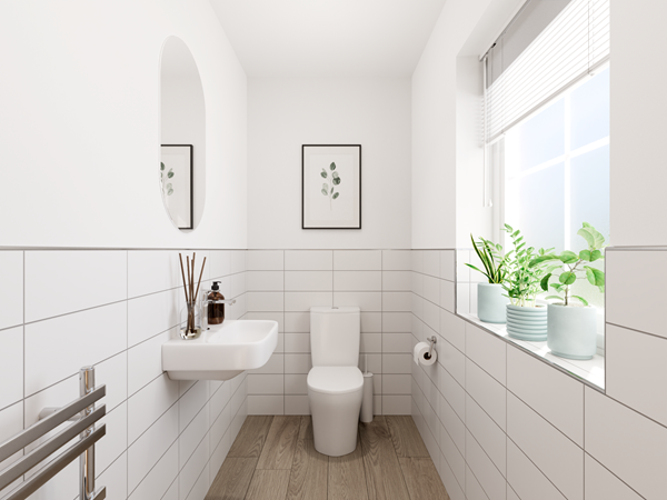 Modern bathroom with white tiles, wall-mounted sink, toilet, wooden floor and window with potted plants.