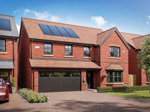 Front view of a five-bedroom detached home with double garage, driveway, solar panels and landscaped front garden.